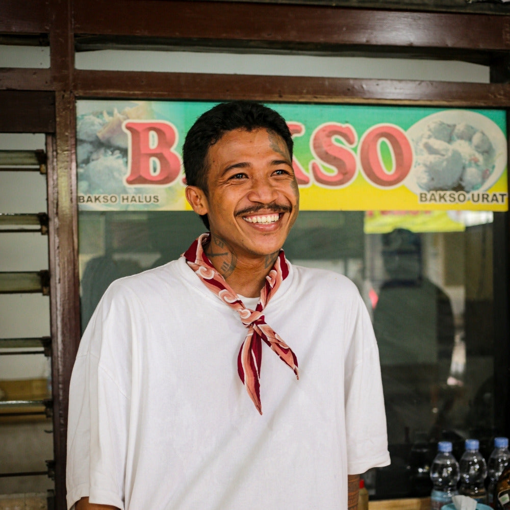 Detail of a handmade Mega Mendung batik bandana showing wax-resist dyeing patterns