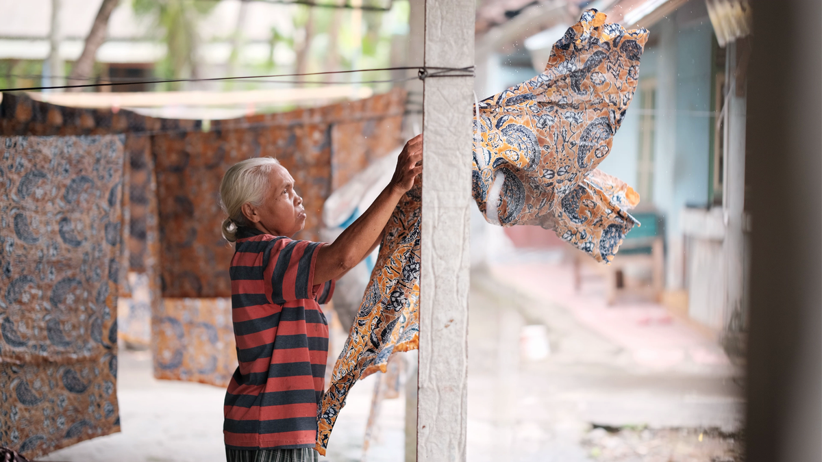 Freshly dyed Batik fabric drying in the Indonesian sun – natural part of the process