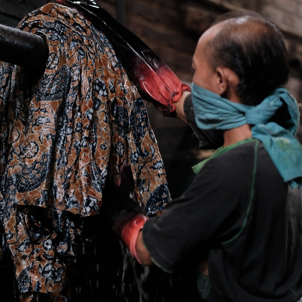 washing the wax for the batik process
